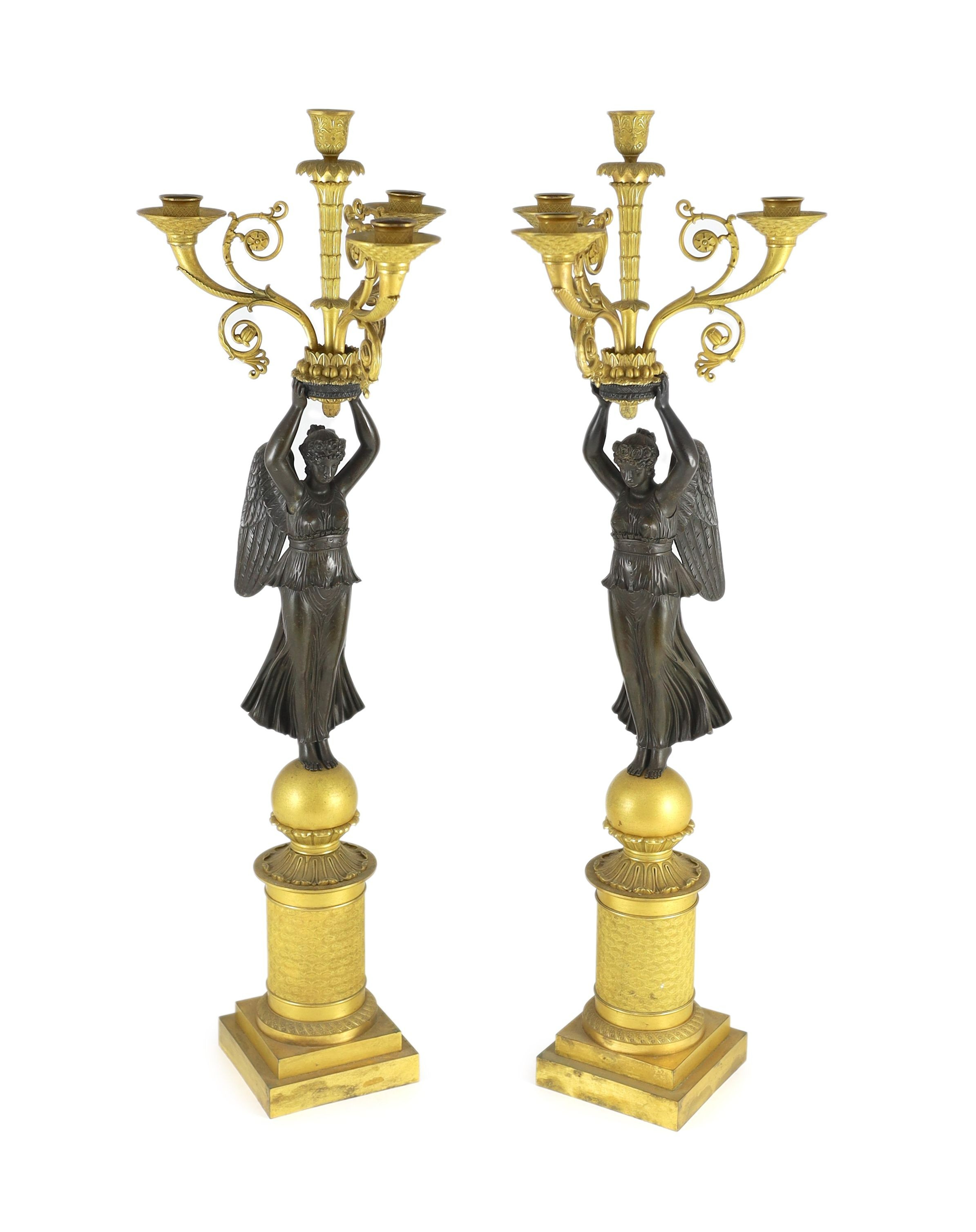 A pair of 19th century French Empire style bronze and ormolu four light candelabra, 21cm wide, 80cm high